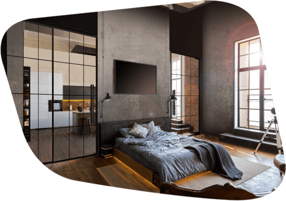 Schlafzimmer mit Bett und Glastüren